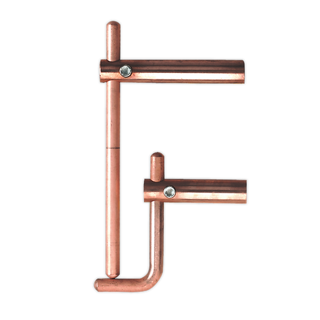 Copper pipe fittings arranged to resemble the letter "F", positioned alongside a sturdy Sealey Spot Welding Arms 120mm Exterior Profiles - 120/803158.