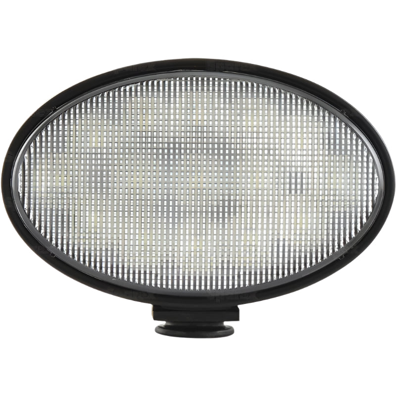 A New Holland LED Work Light by Sparex, featuring an oval shape with a grid texture, black frame, and LED Flood Beam. It boasts a Class 5 Interference rating, 4500 Lumens Raw output, and an IP6K9K Rating for ultimate durability. The light operates within a voltage range of 10-30V (S.163877).