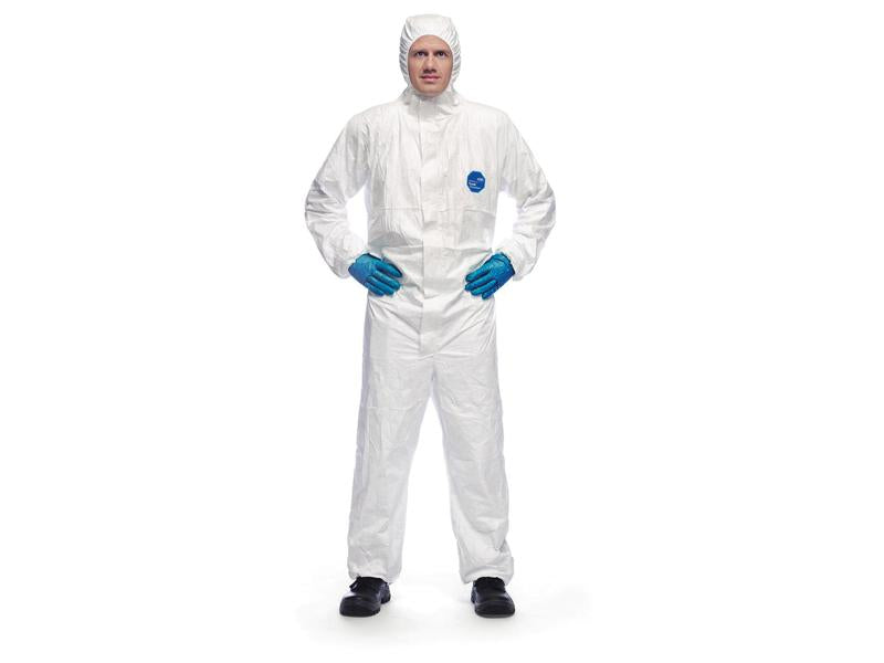 Person wearing a white DuPont Tyvek 500 Xpert hazmat suit (Sparex Part Number: S.164216), blue gloves, black shoes, and a hood, standing with hands on hips. The suit appears to be of CAT III standard and size XL.
