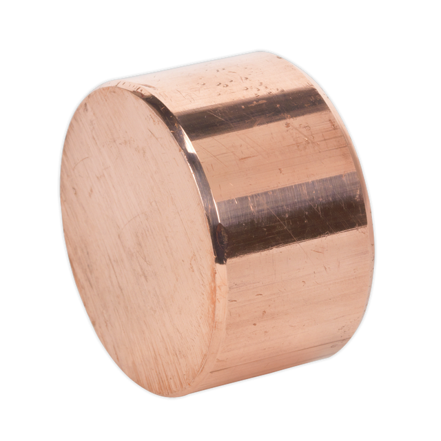 A cylindrical piece of polished copper, posing on its circular face against a white background, reminiscent of the Sealey Copper Hammer Face for CFH04 & CRF35 - 342/314C, ideal for Premier Hand Tools and professional use.