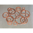 A Sealey Copper Sealing Washer Assortment 250pc - Metric (AB020CW) is scattered on a metal surface.
