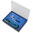 The Sealey Air Brush Kit Gravity Feed - AB9321 features a metal body, double-action trigger, 0.3mm nozzle, hose, cleaning brush, pipette, wrench, and two small containers all neatly packaged in a foam-lined box with a transparent lid.