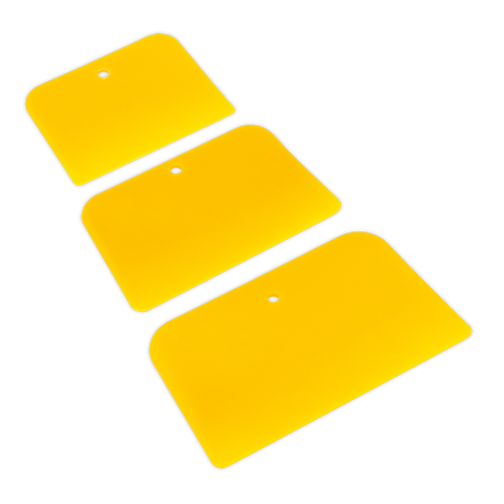 The Body Filler Applicator Set 3pc - AK5225 by Sealey includes three yellow, rectangular applicators with rounded edges and black borders. Each applicator features a hole near the edge for easy hanging and comes in different widths to accommodate various needs.