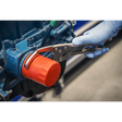 A gloved hand uses Sealey's Ø45-130mm Oil Filter Locking Pliers - Angled (AK6423) to tighten a red oil filter on a blue engine component.