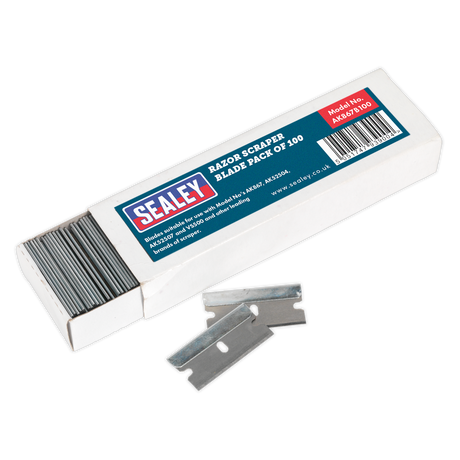Box of Sealey Razor Scraper Blade Pack of 100 - AK867B100. The box is open, revealing multiple scraper blades stacked inside, with two placed in front. The box is labeled "Razor Scraper Blade Pack of 100 - AK867B100.
