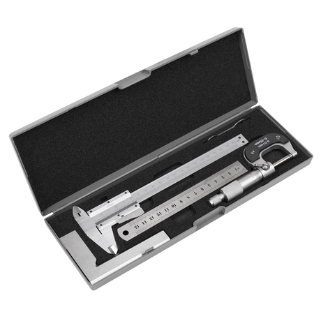 The Measuring Tool Set 4pc - AK91SET by Sealey includes a metallic caliper, micrometer, and stainless steel rule, all placed inside an open black foam-lined gray case.
