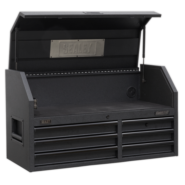 The Sealey Topchest 6 Drawer 1030mm with Soft Close Drawers & Power Strip - AP4106BE has an open lid that reveals a spacious upper compartment featuring the Sealey logo, along with six closed drawers underneath. Constructed from heavy-duty steel, it includes ball-bearing drawer slides and side handles for portability.