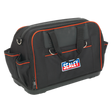 A heavy-duty tool storage bag measuring 500mm, featuring 24 pockets and designed in black with red accents. It includes an adjustable padded shoulder strap and proudly displays the Sealey logo on the front. For added durability, it also boasts a waterproof rubber base.