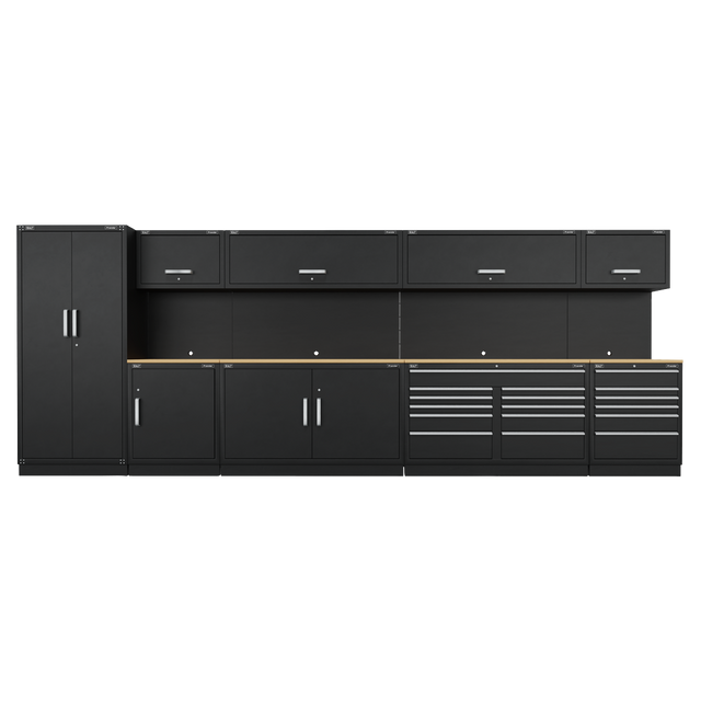 A row of black Heavy-Duty Modular Cabinets from Sealey, known as the Premier 5.6m Storage System - Oak Worktop - APMSOAK, includes two tall cabinets, three wall cabinets, and multiple drawers, all featuring sleek silver handles. These durable units come with a robust oak worktop and a 10-year guarantee.