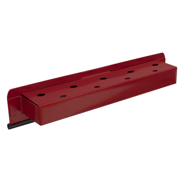The Sealey Magnetic Screwdriver Holder - APSDH is a red metal bracket featuring multiple holes and a black lined base, designed to securely attach to any ferrous metal surface using powerful vinyl-covered magnets.