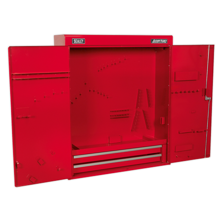Sealey Wall Mounting Tool Cabinet - APW750 features double, lockable doors crafted from heavy gauge steel. Open to reveal an empty interior with two drawers at the bottom, numerous small holes, and various storage slots.