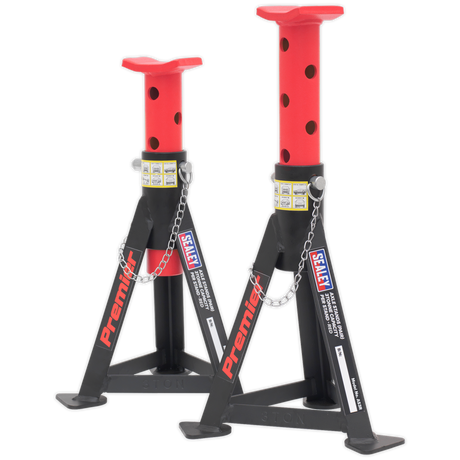 A pair of Sealey axle stands, each with a 3-tonne capacity, in red and black steel, featuring adjustable heights and built for load distribution with welded construction and safety pins.