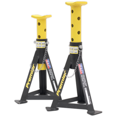 Two yellow steel jack stands with black accents from Sealey, each boasting a 3-tonne capacity and featuring adjustable height settings. These "Axle Stands (Pair) AS3Y" include multi-position pin supports connected by chains for secure load distribution.