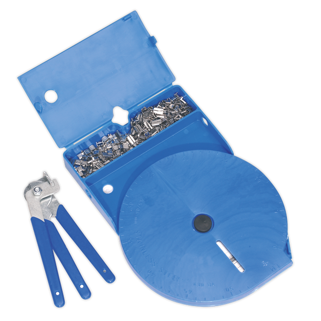 The CVJ Boot Universal Clamp Kit - BSL102 by Sealey includes a blue plastic case containing metal fasteners and a label dispenser roll, alongside a set of distinctive blue-handled crimping tools, ideal for your stainless steel banding needs.