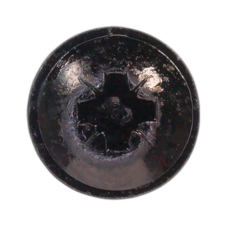 Close-up image of a Sealey Self-Tapping Screw 3.5 x 10mm with a black flanged head, Pozi drive, shiny surface, and visible wear from the BST3510 pack of 100.