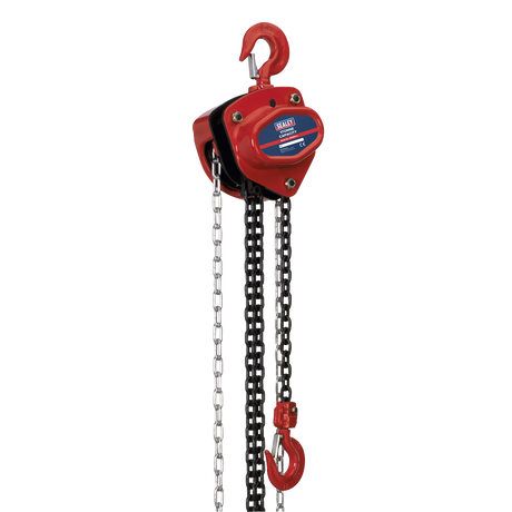 The Sealey Chain Block 1 Tonne 2.5m - CB1000 is a red manual chain hoist with a heavy-duty hook, black lifting chain, and a segmented pull chain, designed for lifting heavy objects. It features a mechanical load brake and components made from heat-treated hardened alloy material for enhanced durability and performance.