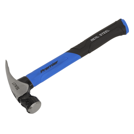 A blue and black Sealey claw hammer with a fibreglass shaft, featuring "Premier" and "Real Steel" branding, a magnetic nail starter for convenience, and "SAFETY" engraved on the 20oz metal head (Model: CLHG20).