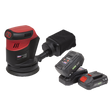 A Sealey Cordless Orbital Palm Sander Kit Ø125mm 20V SV20 Series, model CP20VOSKIT, is shown in red and black with a dust collection bag, accompanied by two battery packs and a battery charger.
