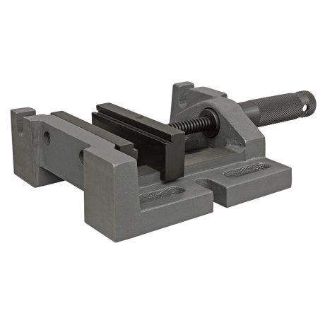 The Sealey Drill Vice 100mm 3-Way - DV3D, featuring a rotating handle for tightening and flat jaws for securely holding objects in place, is an essential addition to any workshop equipped with a milling machine.
