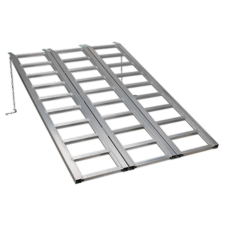 The Sealey Motorcycle/Trike/ATV & Mini Tractor Ramp Wide Tri-Fold 680kg Capacity (FLR680T) is a foldable, aluminium loading ramp designed with a grid pattern, featuring two side-by-side lanes and a safety chain on one side, perfect for loading and unloading vehicles.