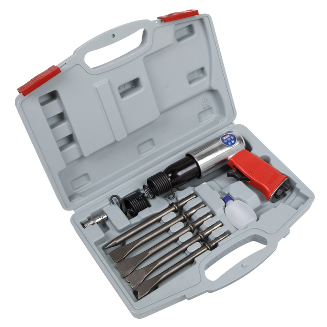 The Sealey Air Hammer Kit Long Stroke - GSA11, organized in a gray plastic carrying case with red clips, includes various attachments and accessories. The air hammer itself features a soft grip for comfortable use and is designed to minimize noise emissions.