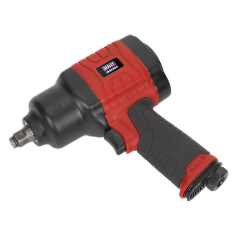 The Sealey Composite Air Impact Wrench 1/2"Sq Drive - Twin Hammer (GSA6002) features a striking black and red design with a textured grip handle and a durable metal square drive. Its robust construction guarantees maximum breakaway torque, perfect for tackling heavy-duty tasks. Displayed against a white background, its industrial strength is unmistakably clear.