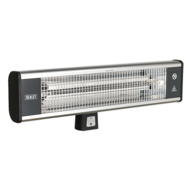 The High Efficiency Carbon Fibre Infrared Wall Heater 1800W/230V - IWMH1809R by Sealey features a metallic grill and control buttons underneath. The brand name "Sealey" is clearly visible on the left side. This IP65 rated industrial heater is designed for both indoor and outdoor use, providing durability and reliability in various environments.