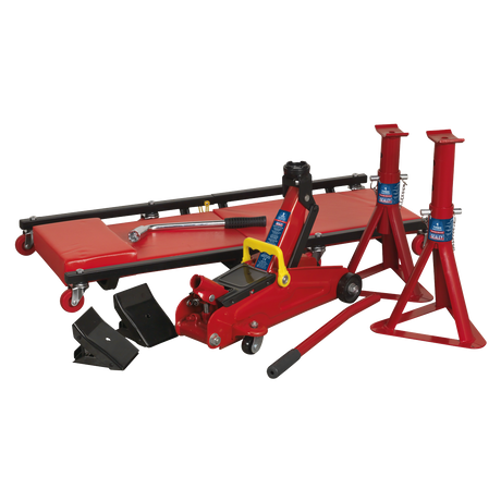 Introducing the Sealey Lifting Kit 5pc 2 Tonne - JKIT01, a comprehensive red automotive jack set that includes a Tonne trolley jack, two axle stands, two wheel chocks, and a car creeper with a padded surface and wheels.
