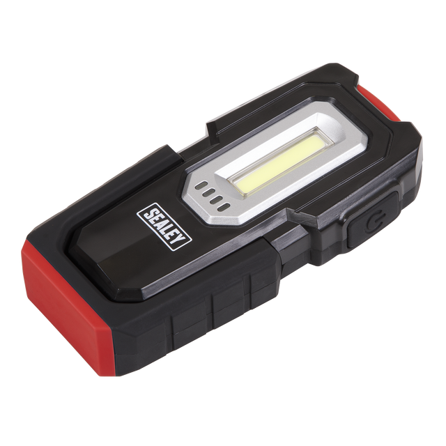 A handheld Sealey Inspection Light 3W COB & 1W SMD LED - Wireless Rechargeable - LEDWC03 in black and red, with a side power button and a magnetic base for easy attachment.