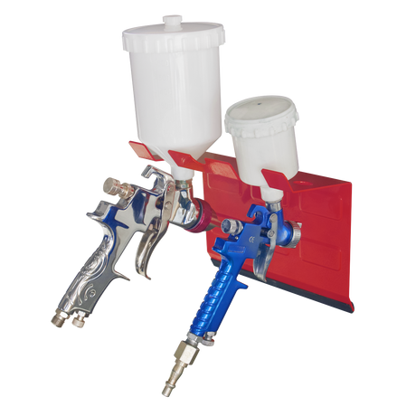 Two paint spray guns (one silver and one blue) are mounted on a red **Magnetic Spray Gun Holder - 2 Gun - MSH03** by **Sealey**, set against a white background. The silver gun features a larger white paint container, while the blue gun has a smaller one. This setup includes heavy-duty magnetic brackets offering secure storage for the spray guns.