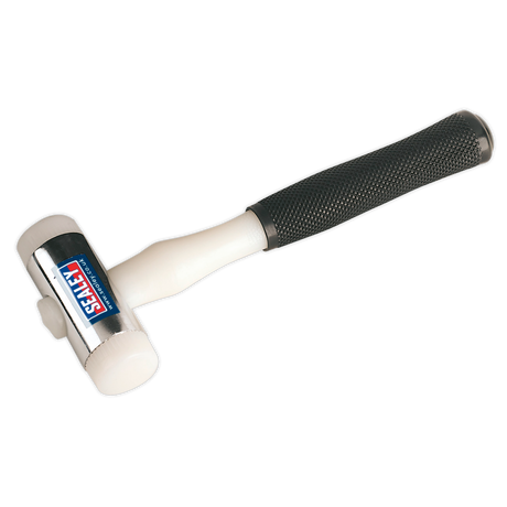 The Sealey Hammer Nylon Faced 1.25lb - NFH15 is a versatile white mallet with a black, textured handle and features the brand "Sealey" on the head. This Premier Hand Tools product boasts chrome-plated zinc heads and interchangeable nylon faces for added durability and adaptability.