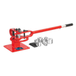 The Sealey Metal Bender Bench Mounting - PBB04, a red manual metal bender with a long handle and multiple interchangeable dies for creating radiused bends, is lying beside it on a white background.