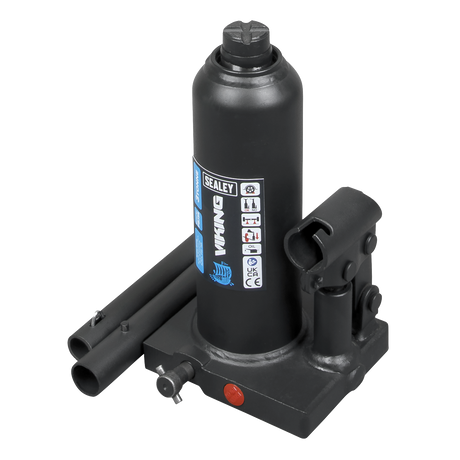 The Sealey Bottle Jack 3 Tonne - PBJ3S is a black hydraulic jack featuring a 2-piece handle and machine-welded construction. It includes an overload valve, a specification label, and is designed for effortlessly lifting heavy objects.