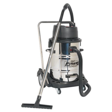 The Sealey Vacuum Cleaner Industrial Wet & Dry 77L Stainless Steel Drum with Swivel Emptying 2400W - PC477 is a high-performance unit boasting superior vacuuming power. It features a durable stainless steel body, a black plastic top, and a black hose attachment. The vacuum cleaner also comes equipped with a wheeled base for easy mobility.