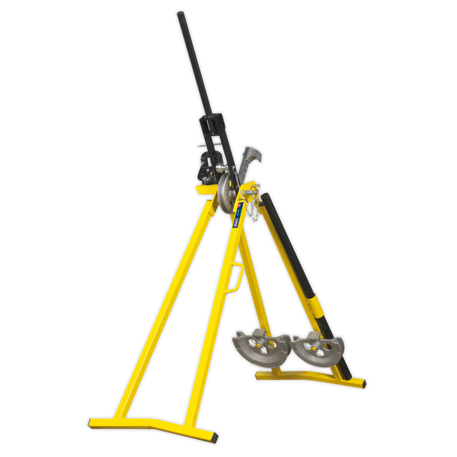 The Sealey Professional Conduit Bender - PCB25 is an industrial pipe bender featuring a yellow frame and a black handle, designed to bend metal pipes. Resembling an A-frame conduit bender, this machine is securely mounted on a sturdy triangular stand.