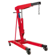 The Sealey Fixed Frame Engine Crane with Extendable Legs 3 Tonne - PH30 is a red hydraulic hoist featuring a lifting arm, hook, and chain. Designed for industrial use, it boasts a wheeled base with heavy-duty castors for mobility and an adjustable boom that can handle heavy engines and machinery up to a 3000kg lifting capacity.