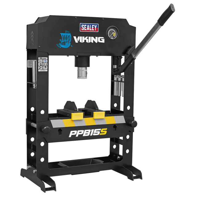The Sealey Viking Hydraulic Press 15tonne Bench Type - PPB15S features a robust heavy-duty steel frame with an elegant black finish. It is equipped with a pressure gauge and a lever on the right side for control. Additionally, the press includes two yellow components below the press mechanism, ensuring it is designed to handle tough jobs with precision.