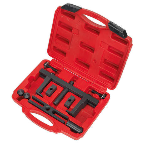 The Sealey Crankshaft Pulley Removal Tool Set 12pc - PS997 comes in a red plastic case, featuring a set of black metal automotive timing tools specially designed for crankshaft pulley removal, all organized neatly in designated compartments.