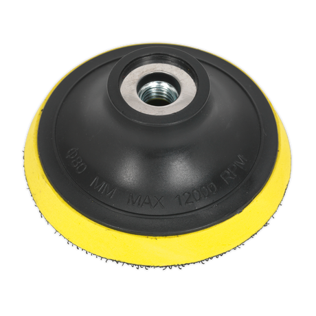 An image of a black and yellow Hook-and-Loop Backing Pad Ø75mm M10 x 1.5mm - PTC75VM10 by Sealey, featuring a threaded center for attaching to power tools, labeled with "Max 12000 RPM". This versatile backing pad is designed for compatibility with hook-and-loop backed polishing foam heads, offering efficiency and ease of use.