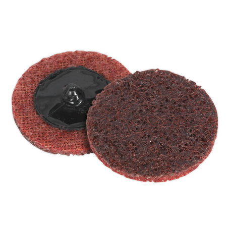 Two Quick-Change Preparation Pads (Sealey PTCQC50M) with red-brown textured surfaces are shown. One pad faces up displaying the textured side, while the other exposes the black mounting hub on its back. Ideal for use with air mini sanders, these Ø50mm medium pads ensure efficient surface prepping. Pack of 10.