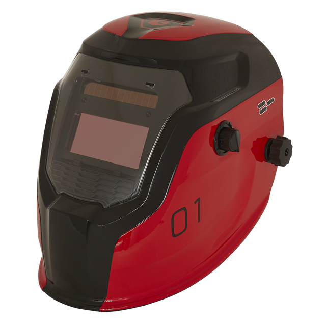 A Sealey Welding Helmet Auto Darkening - Shade 9-13 in red (PWH1), featuring a tinted viewing window and adjustment knobs on the side. The number "01" is printed on the surface, and it includes adjustable shade control for optimal vision.