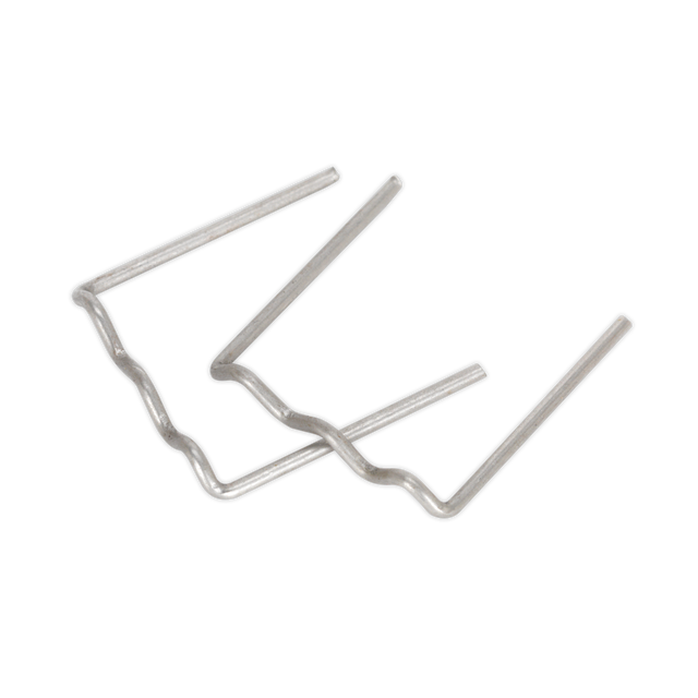 Two metal staples, possibly Sealey U-Staple 0.8mm Pack of 100 - RE08, bent out of their original shape, lie on a plain surface.