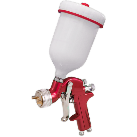 The Sealey Gravity Feed Spray Gun 1.4mm Set-Up - S714G is a red and silver tool featuring an adjustable spray width and a white container on top, ideal for automotive refinishing and spraying paint onto surfaces.
