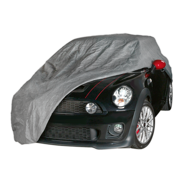 A black car partially covered with the Sealey All Seasons Car Cover 3-Layer - Small - SCCS, exposing its front, headlights, and red side mirrors. This professional car cover features waterproof 3-layer material and provides excellent UV/heat protection.