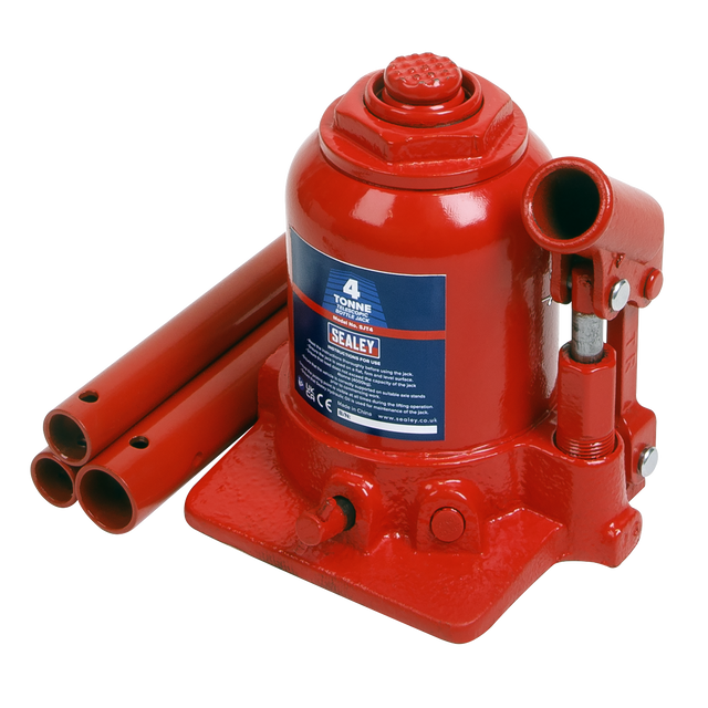 The Sealey Bottle Jack 4 Tonne Telescopic - SJT4 features a red cylindrical body, a handle, and three detachable lever bars. It offers a lifting capacity of 4 tonnes and includes an overload valve for added safety. Additionally, this hydraulic jack is equipped with dual-stage rams for extended travel during lifting operations.
