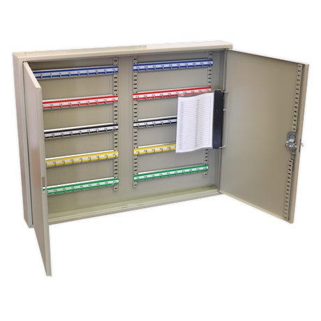 The Sealey Key Cabinet 100 Key Capacity Wide (SKC100W) is a metallic cabinet with an open door, revealing multiple rows of colored key tags and a clipboard with paper attached to the interior of the door, showcasing its steel construction for added durability.