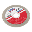 A Sealey branded Grinding Disc Diamond Coated 100mm with a red and white label indicating Model No. SMS2003.B, featuring a free speed of 5300rpm and safety instructions. Ideal for pairing with a saw blade sharpener to maintain its cutting precision.