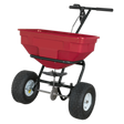 The Sealey Broadcast Spreader 57kg Walk Behind - SPB57W features a red and black design, metal frame, heavy-duty pneumatic tires, an adjustable feed system, and two handles.