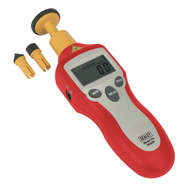 A Sealey Digital Tachometer Contact/Non-Contact - TA050, featuring a red handheld design and an LCD display reading "0.0," is designed for rotational speed measurement and includes two interchangeable probe tips placed beside it.