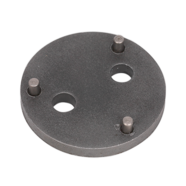 Sealey's Rear Brake Piston Wind-Back Adaptor - VAG - VS02821 is a circular metal plate with four protruding pins and two holes, designed specifically as an adaptor for rear brake calipers on VAG vehicles.